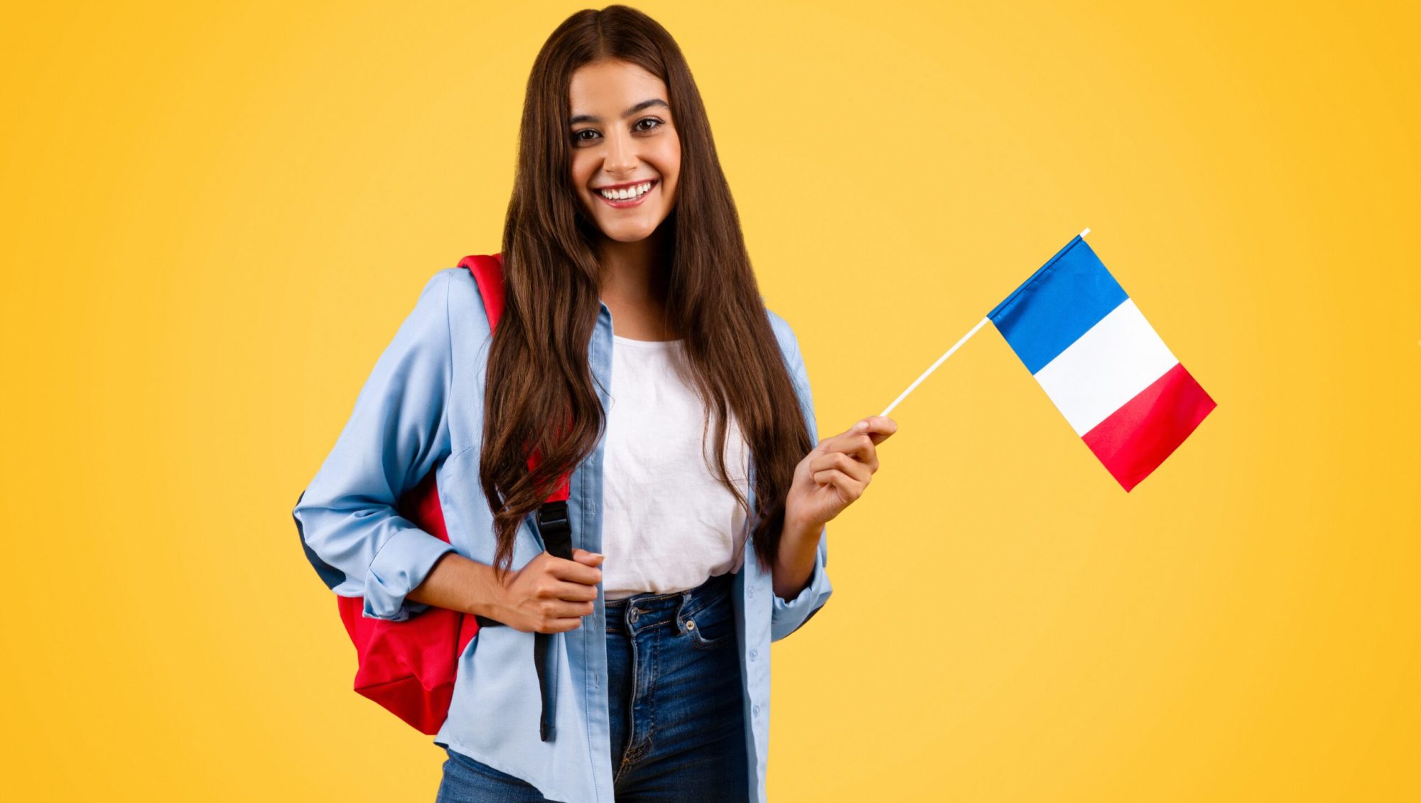 cheerful-caucasian-young-student-woman-with-france-flag-combines-patriotism-with-academia cheerful-caucasian-young-student-woman-with-france-flag-combines-patriotism-with-academia